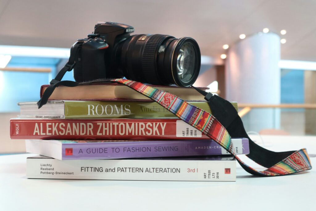 A camera on a stack of books