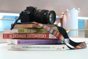 A camera on a stack of books